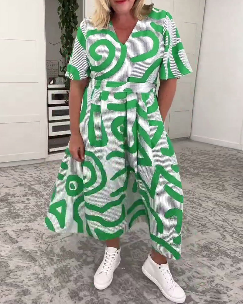 Abito con stampa e tasche con scollo a V