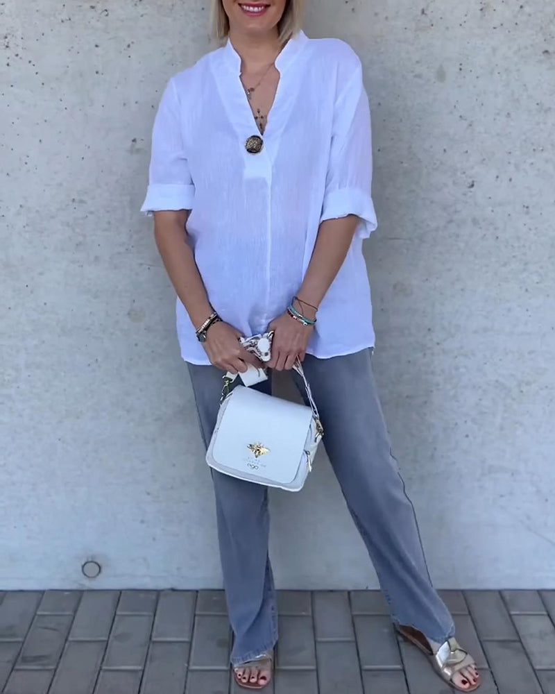 Camicetta in cotone tinta unita con collo alto