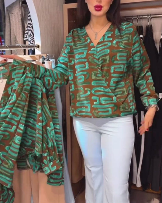 Blusa con stampa geometrica vintage e scollo a V