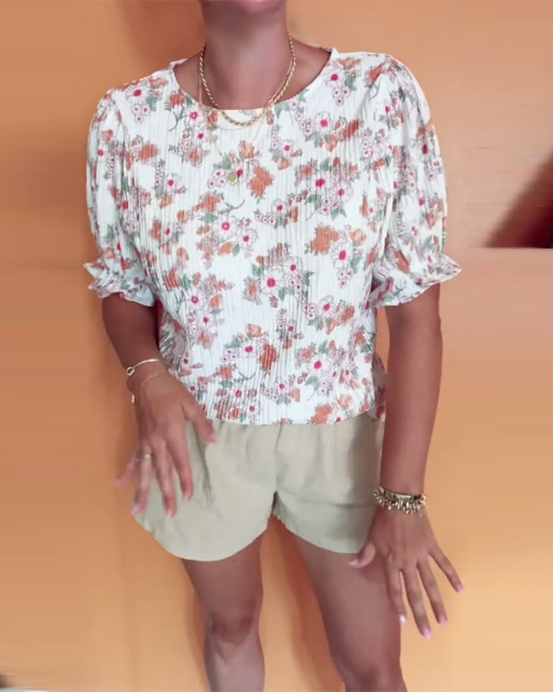 Bluse mit Rundhalsausschnitt und Blumenmuster, kurzärmlig