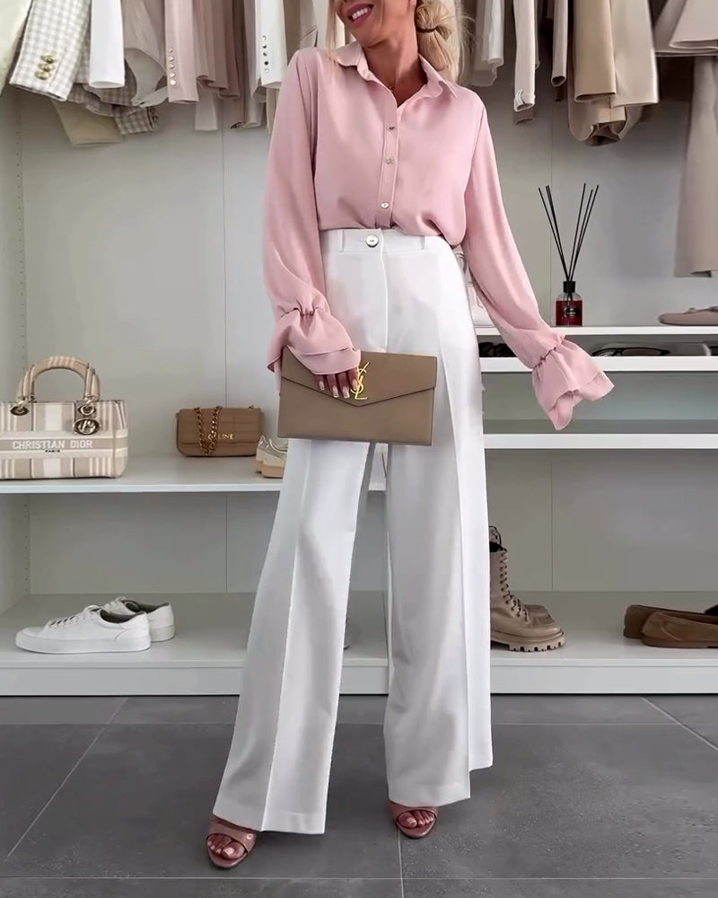 Camicia tinta unita con maniche a campana e bottoni sul risvolto