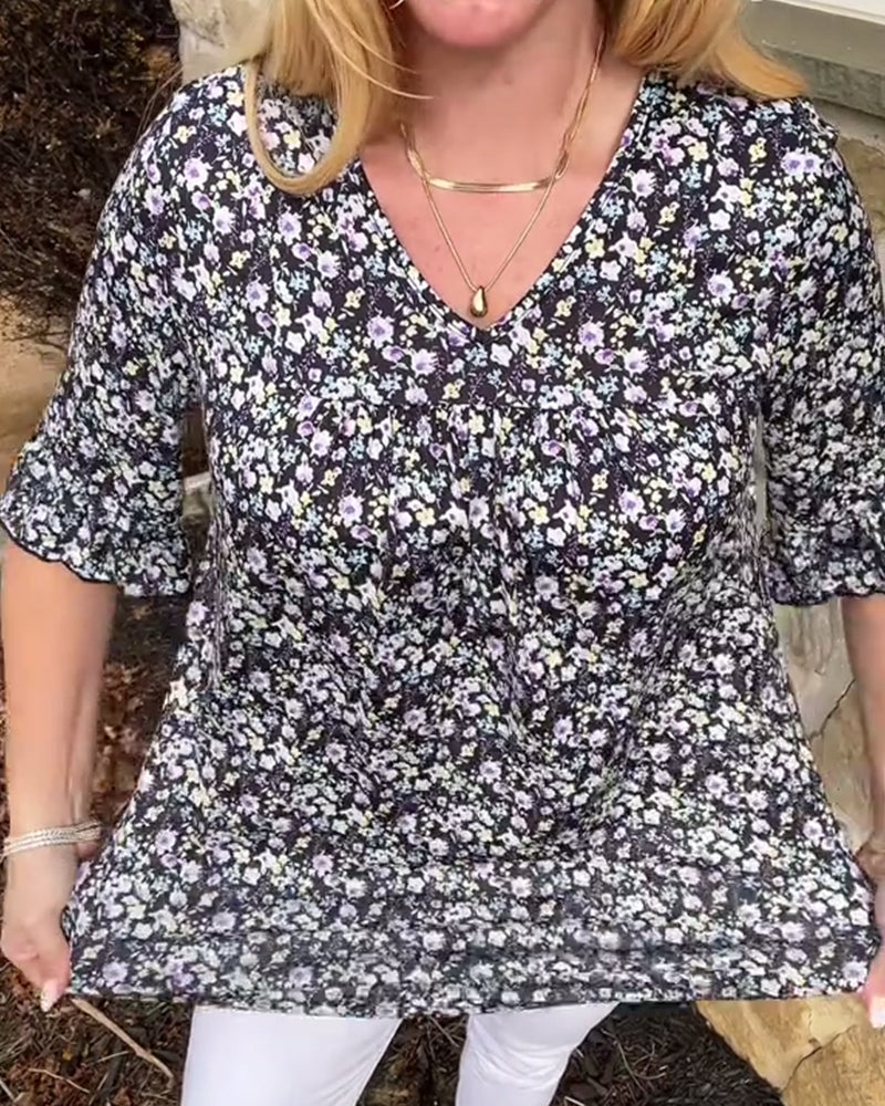 Blusa floreale con scollo a V e maniche corte