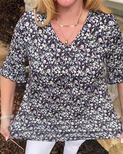 Blusa floreale con scollo a V e maniche corte
