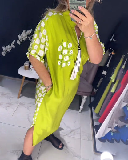 Kleid mit halbem Reißverschluss und unregelmäßigem Schlitz