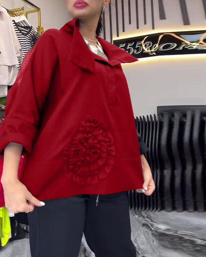 Bluse mit Blumenmuster und Spitzenbesatz am Revers