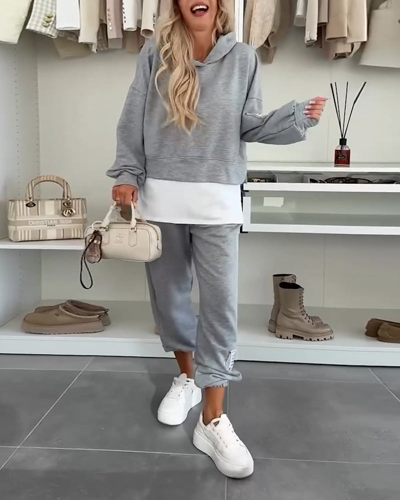 Lässiges Set aus Kapuzenpullover und Hose