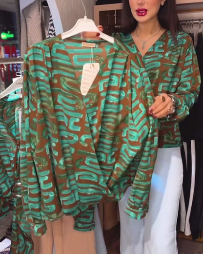 Blusa con stampa geometrica vintage e scollo a V