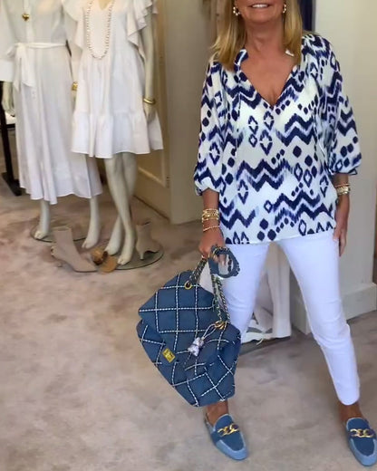 Camicetta stampata con maniche a lanterna e lacci alla moda