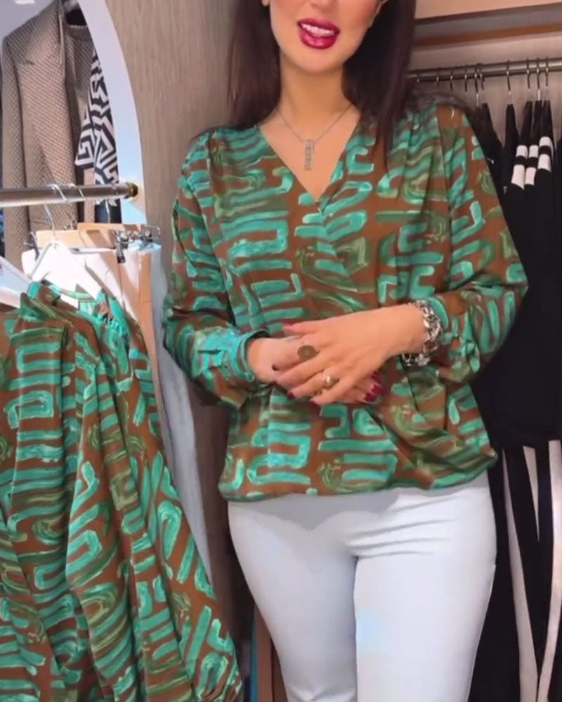 Blusa con stampa geometrica vintage e scollo a V