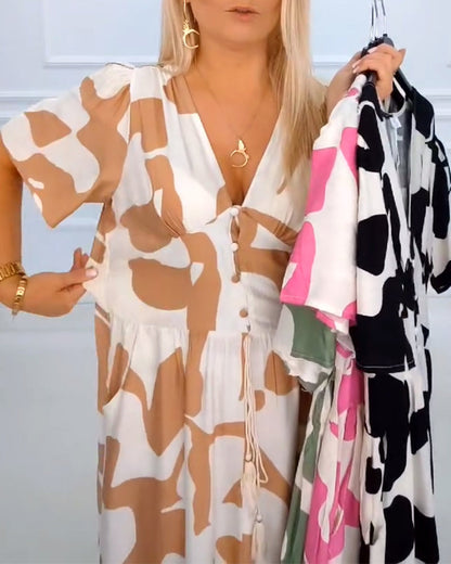 Festliches Kleid mit tiefem V-Ausschnitt und Print