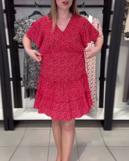 Figurbetontes Kleid mit V-Ausschnitt und Blumenmuster