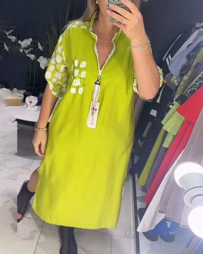 Kleid mit halbem Reißverschluss und unregelmäßigem Schlitz