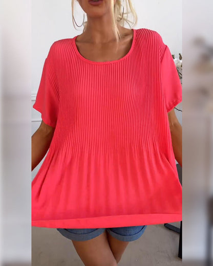 Blusa plissettata a tinta unita con scollo tondo