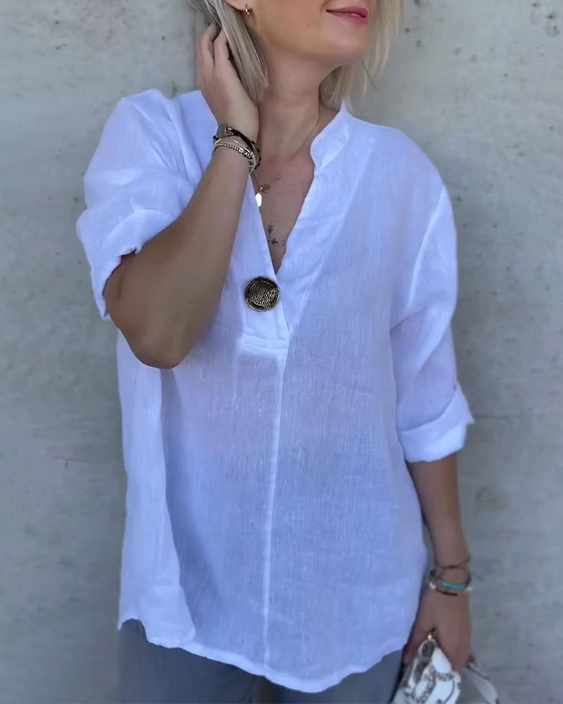 Camicetta in cotone tinta unita con collo alto