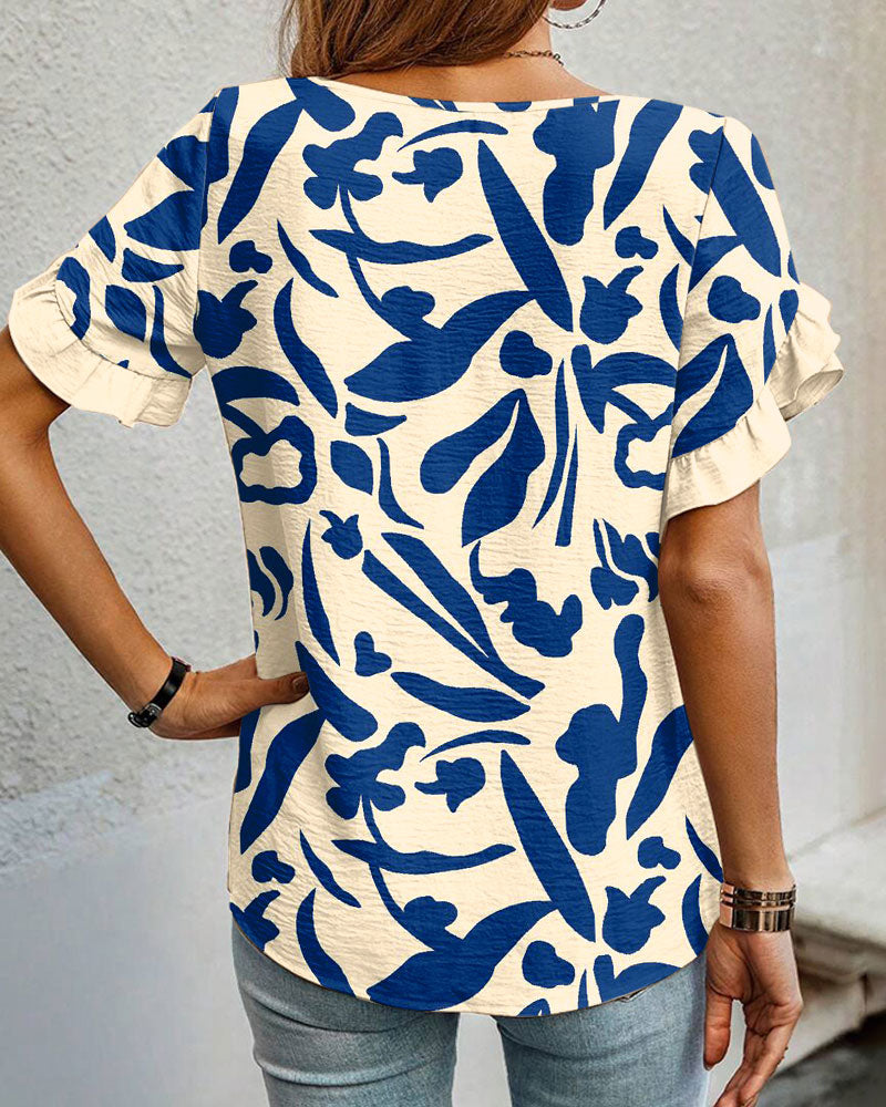 Blusa stampata con scollo tondo e volant