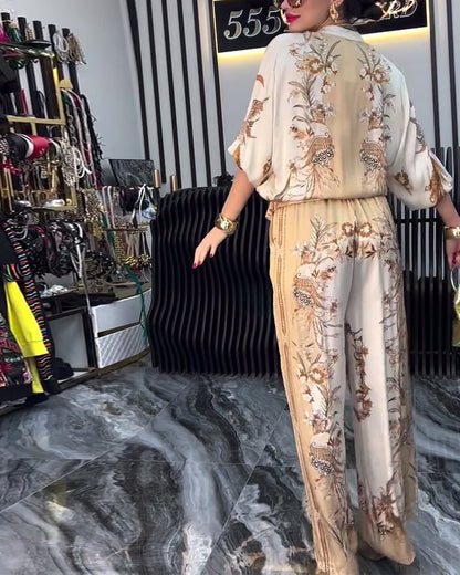 Abito a gamba larga con cerniera e colletto rialzato