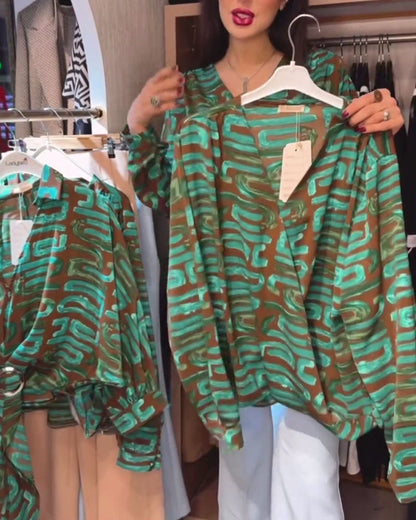 Blusa con stampa geometrica vintage e scollo a V