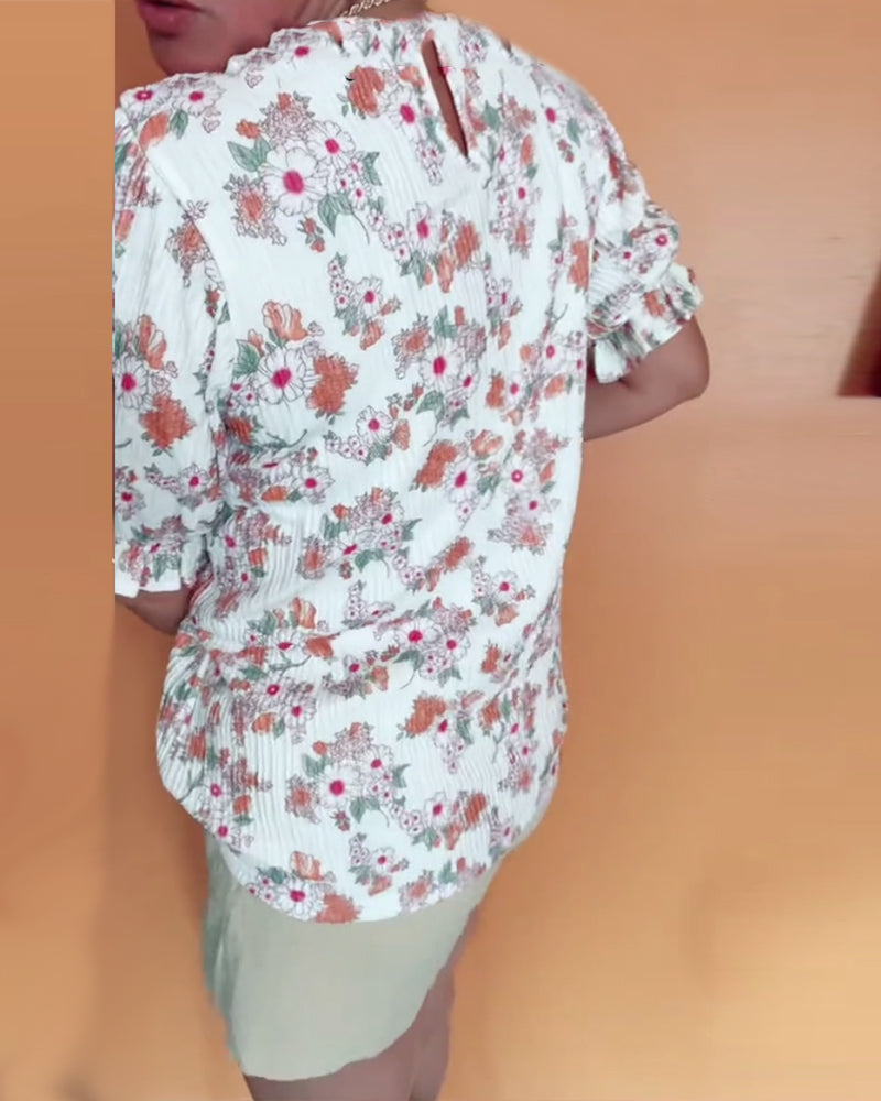 Bluse mit Rundhalsausschnitt und Blumenmuster, kurzärmlig