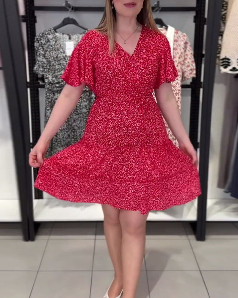 Figurbetontes Kleid mit V-Ausschnitt und Blumenmuster