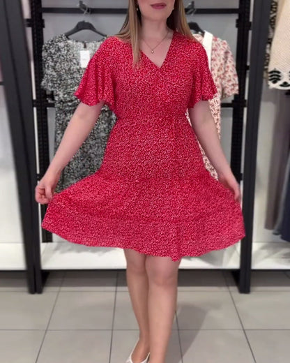 Figurbetontes Kleid mit V-Ausschnitt und Blumenmuster