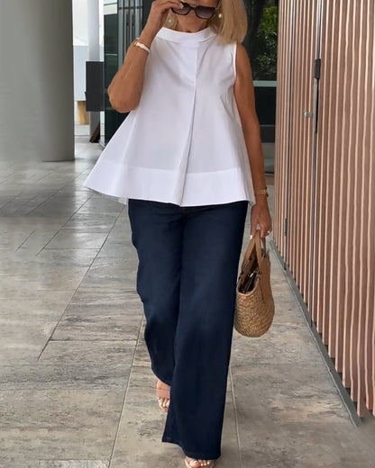 Blusa semplice senza maniche in tinta unita