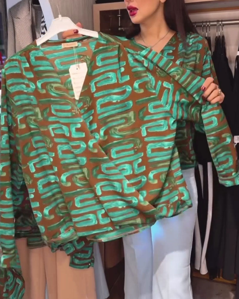 Blusa con stampa geometrica vintage e scollo a V