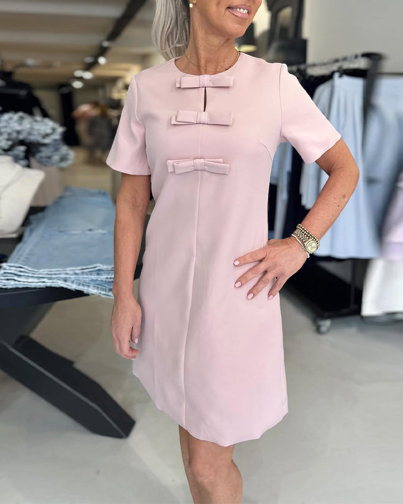 Elegantes Kleid mit Rundhalsausschnitt und Schleife in Volltonfarbe