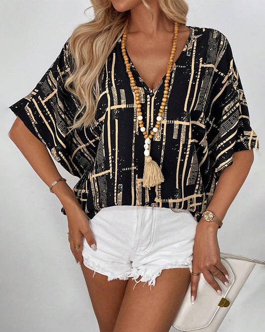 Bedruckte Retro-Bluse mit Fledermausärmeln und V-Ausschnitt
