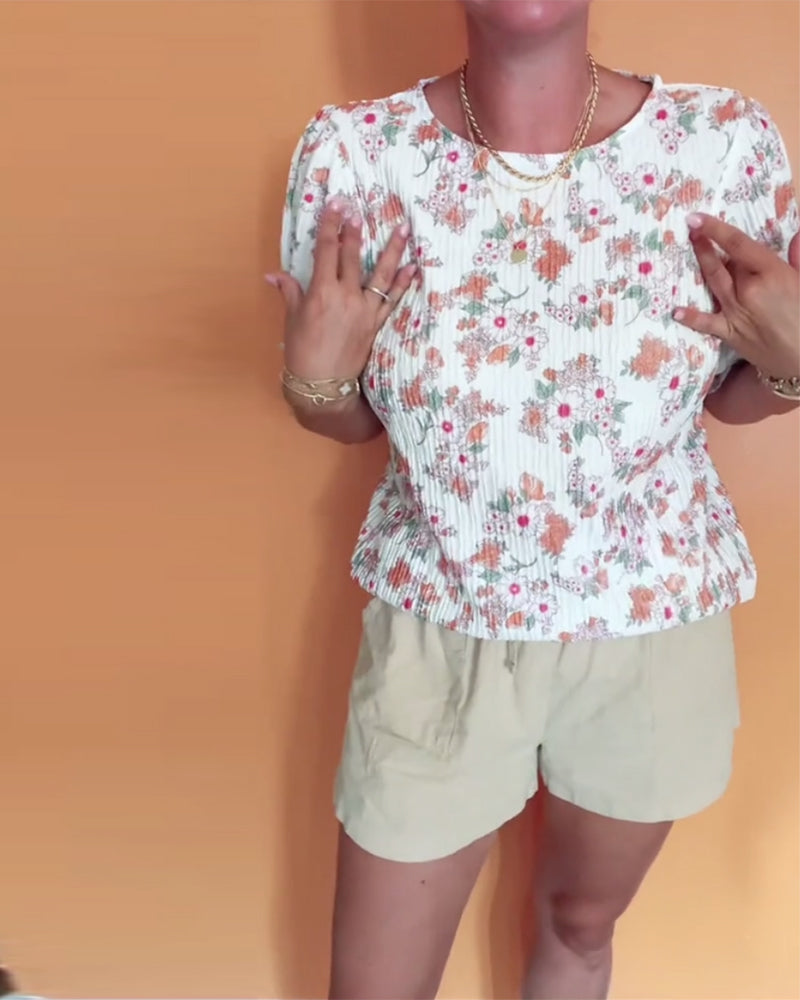 Bluse mit Rundhalsausschnitt und Blumenmuster, kurzärmlig