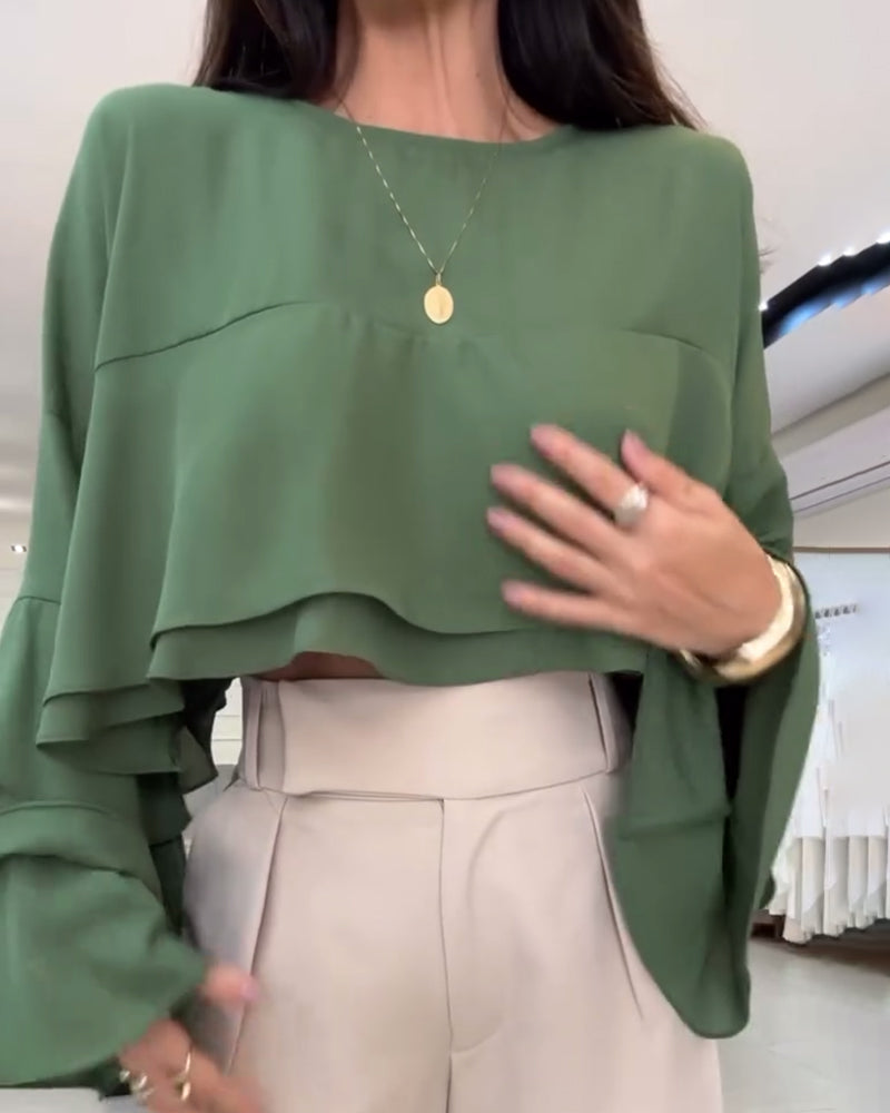 Blusa con doppia manica a sbuffo