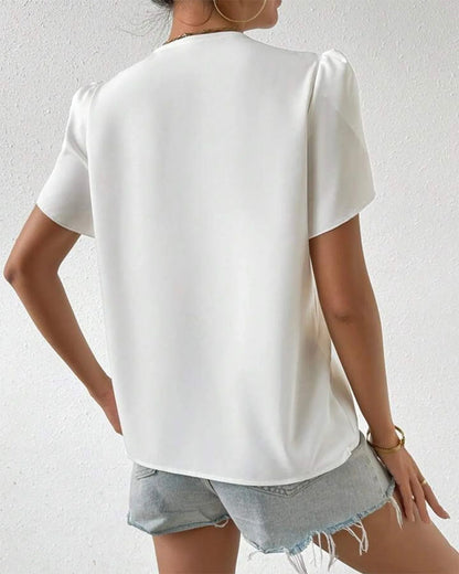 Blusa con maniche a petalo e scollo a V doppio