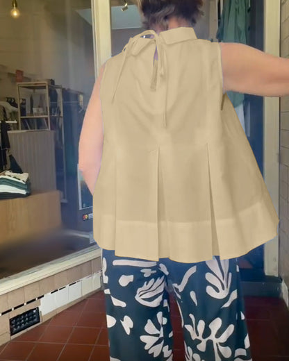 Blusa semplice senza maniche in tinta unita