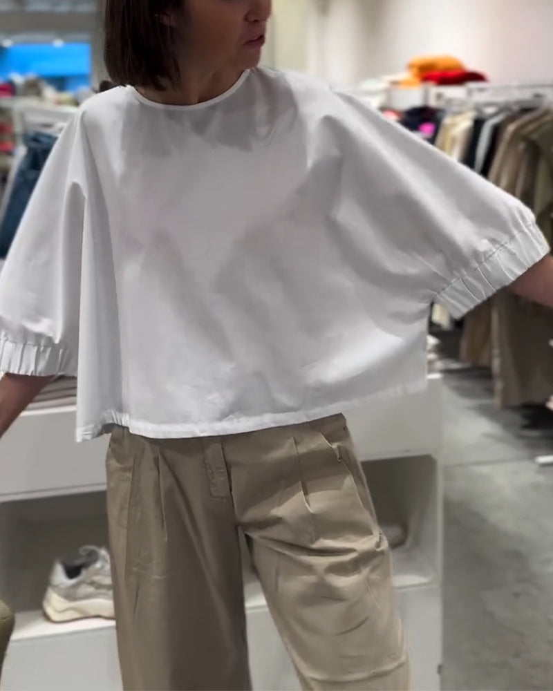 Lockere Bluse mit Fledermausärmeln in Volltonfarbe