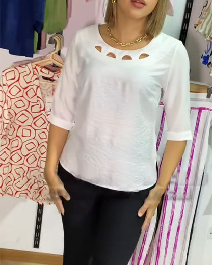 Bluse mit Rundhalsausschnitt und einfarbiger Hohloptik