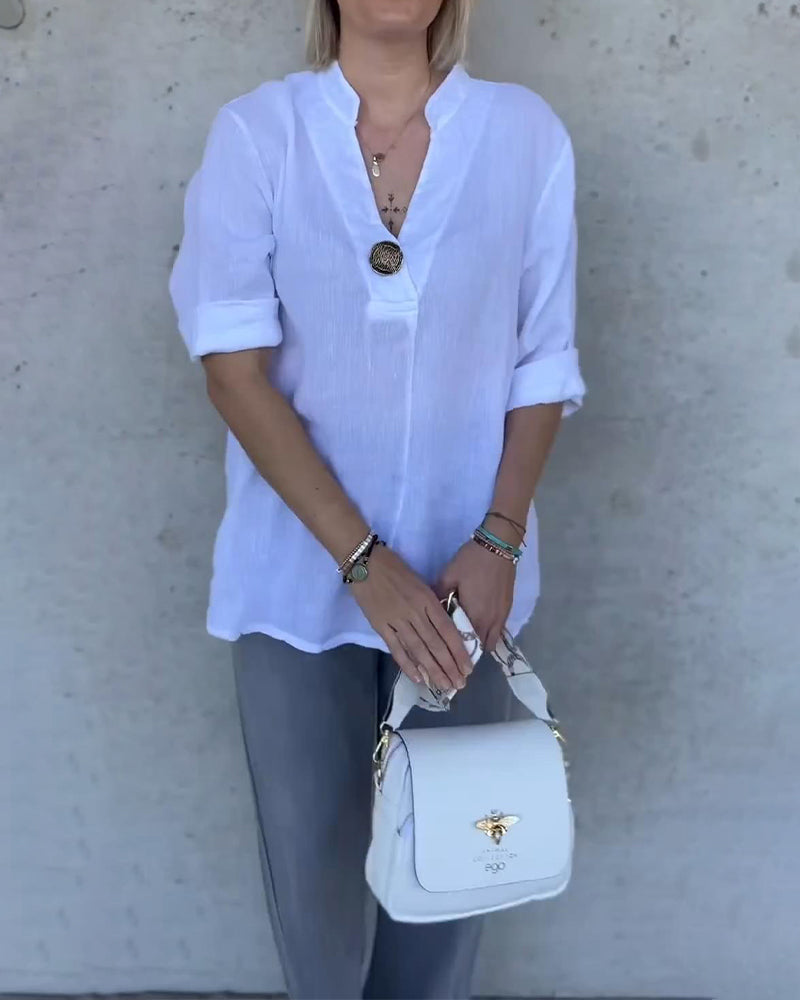 Camicetta in cotone tinta unita con collo alto