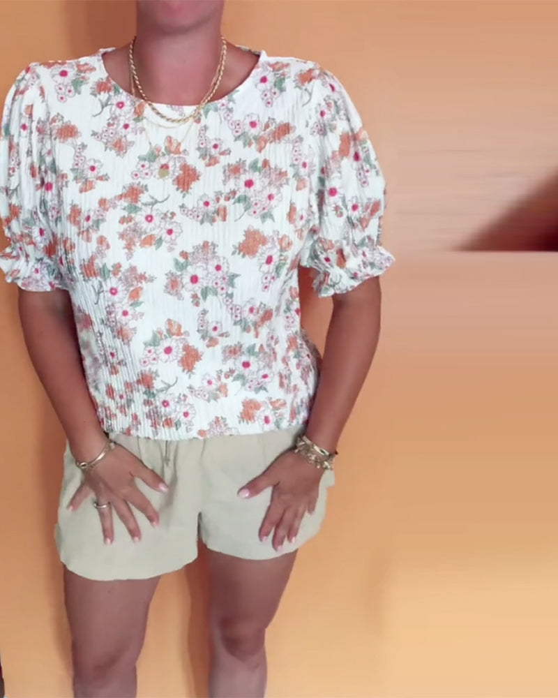 Bluse mit Rundhalsausschnitt und Blumenmuster, kurzärmlig