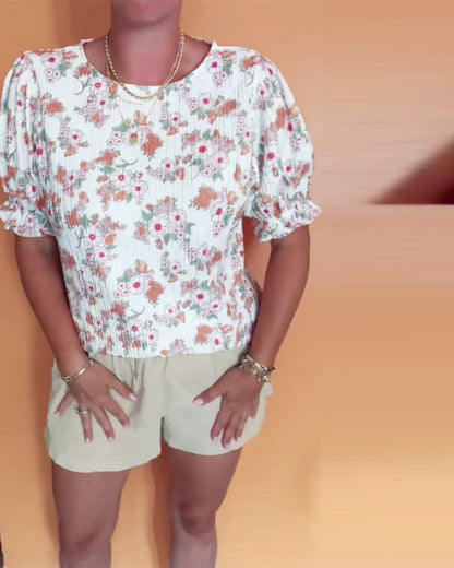 Bluse mit Rundhalsausschnitt und Blumenmuster, kurzärmlig