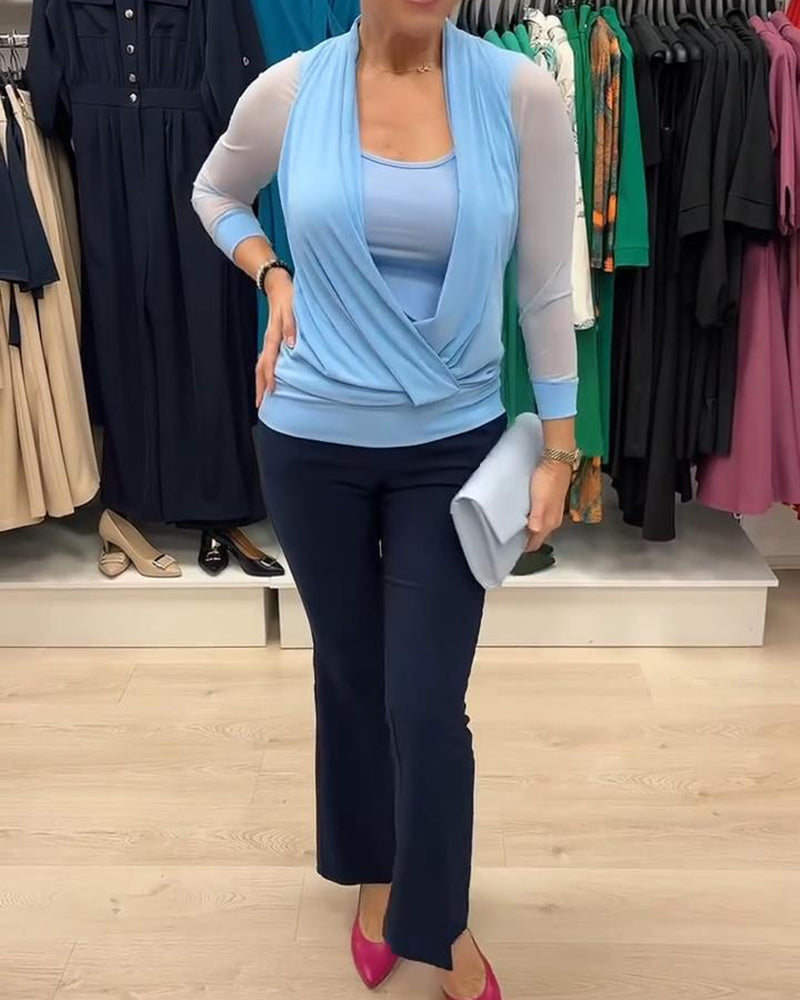 Camicetta trasparente con scollo incrociato