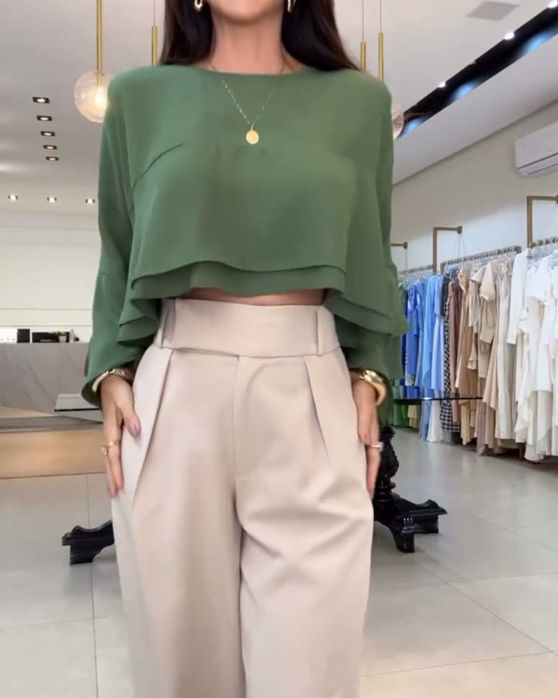 Blusa con doppia manica a sbuffo