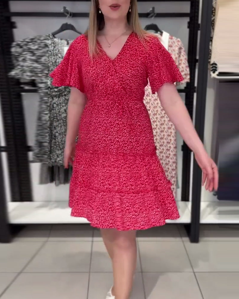 Figurbetontes Kleid mit V-Ausschnitt und Blumenmuster