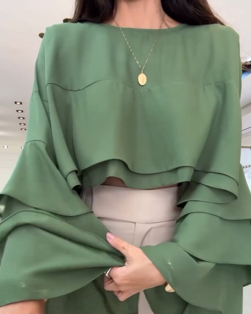 Blusa con doppia manica a sbuffo