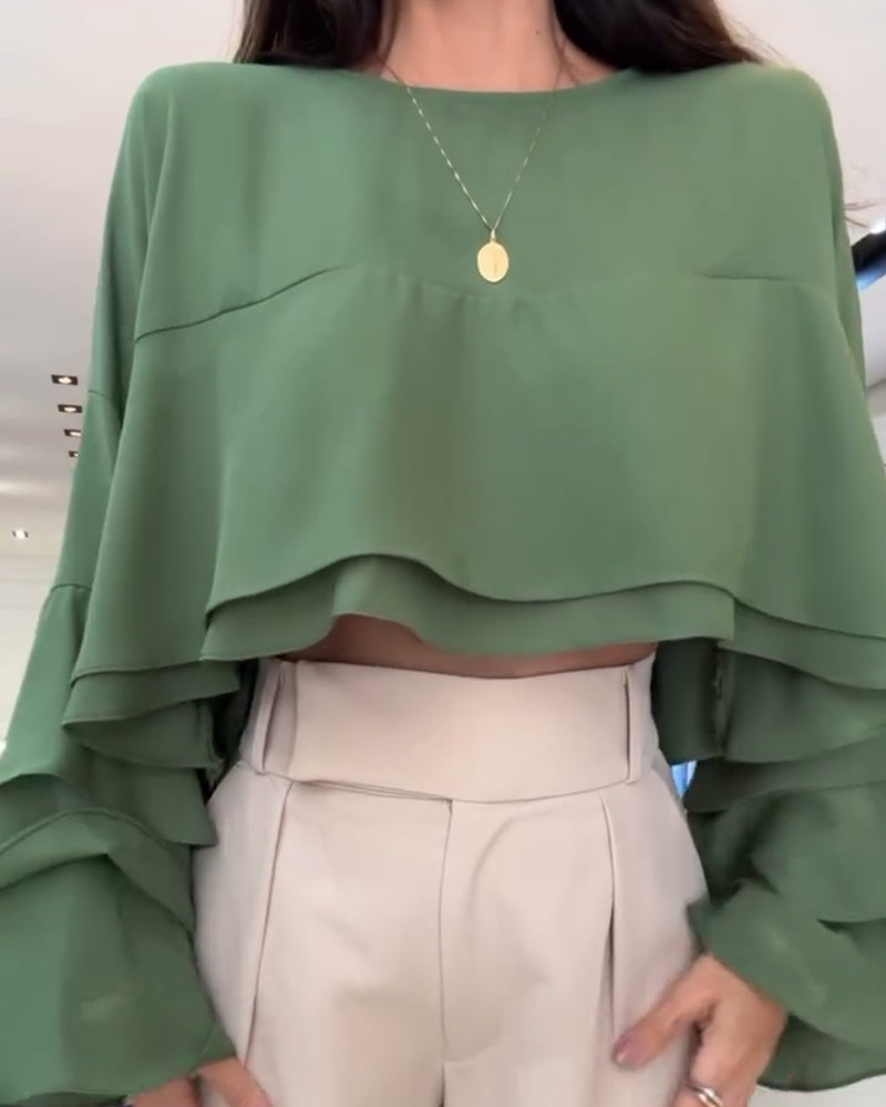 Blusa con doppia manica a sbuffo