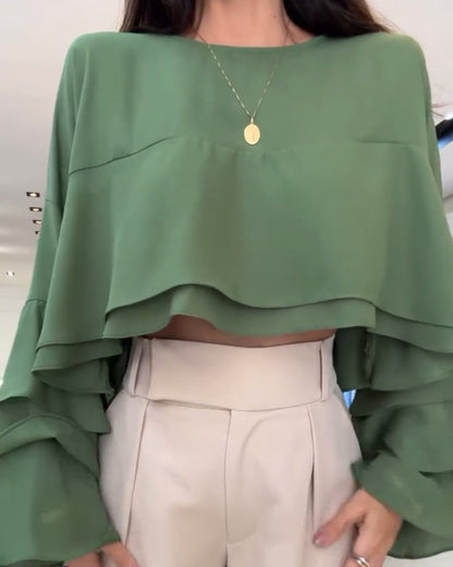 Blusa con doppia manica a sbuffo