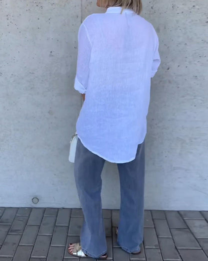 Camicetta in cotone tinta unita con collo alto