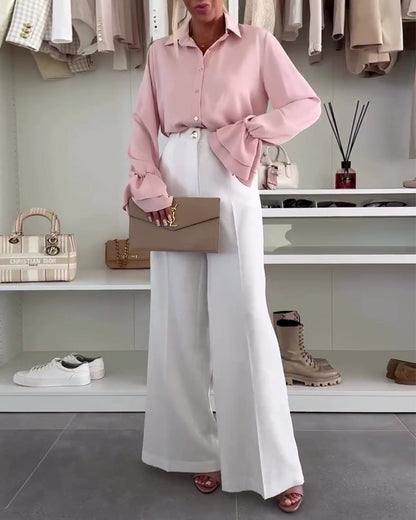 Camicia tinta unita con maniche a campana e bottoni sul risvolto