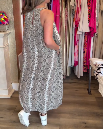 Elegante abito stampato senza maniche con scollo all'americana