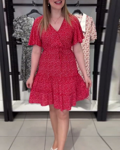 Figurbetontes Kleid mit V-Ausschnitt und Blumenmuster