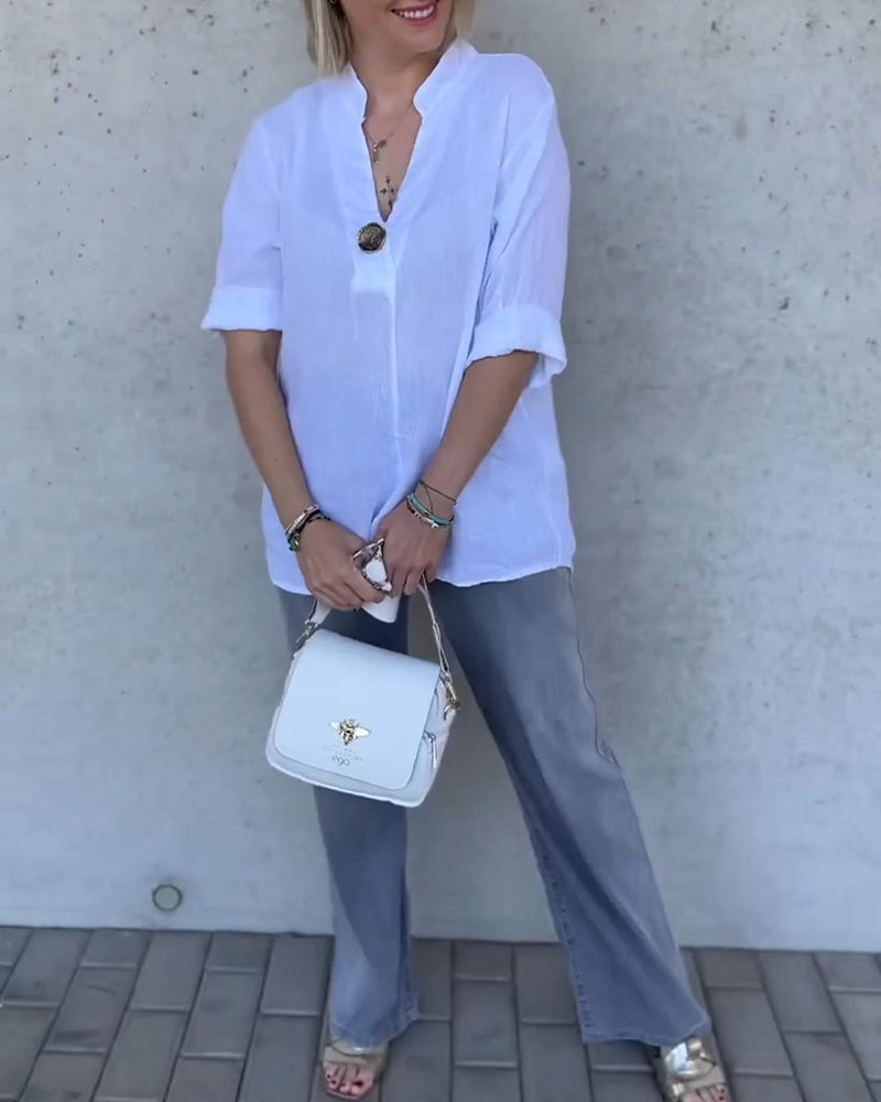 Camicetta in cotone tinta unita con collo alto