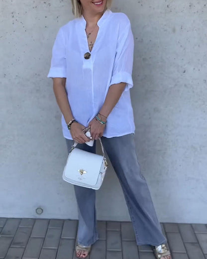 Camicetta in cotone tinta unita con collo alto