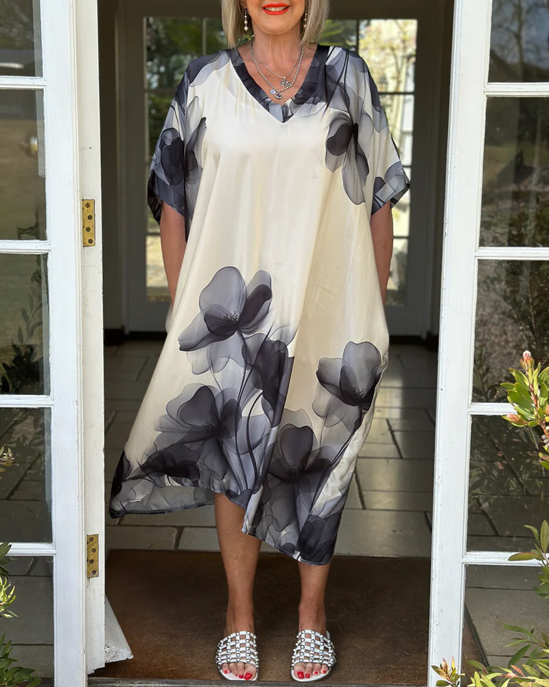 Lockeres Blumenkleid mit V-Ausschnitt und Fledermausärmeln